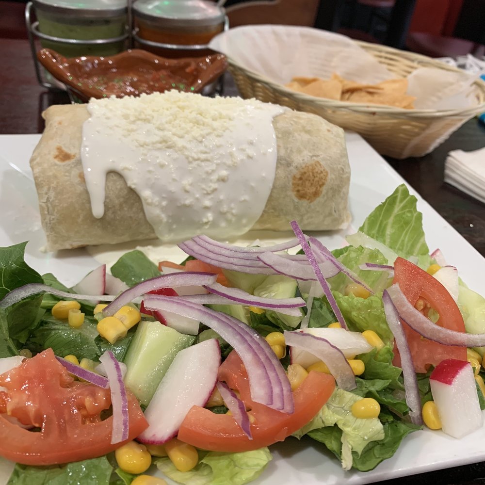 Burrito with a crisp fresh salad
